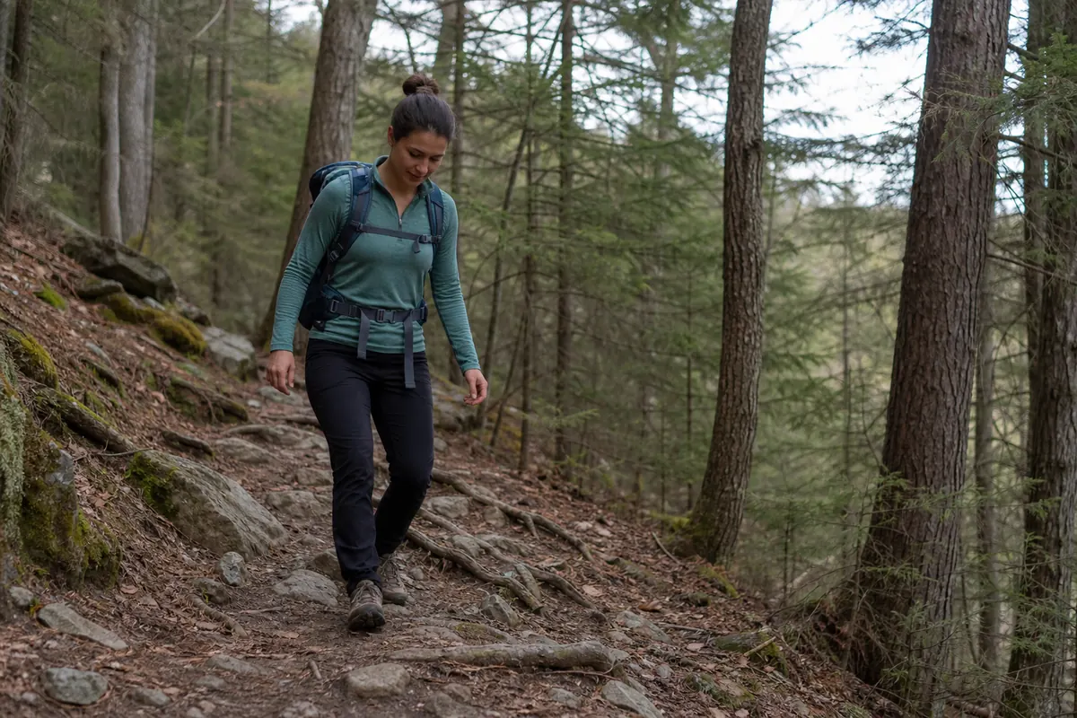 Backpacker practicing deliberate foot placement on a short uneven woodland trail - backpacking terrain training | KnowOutdoor