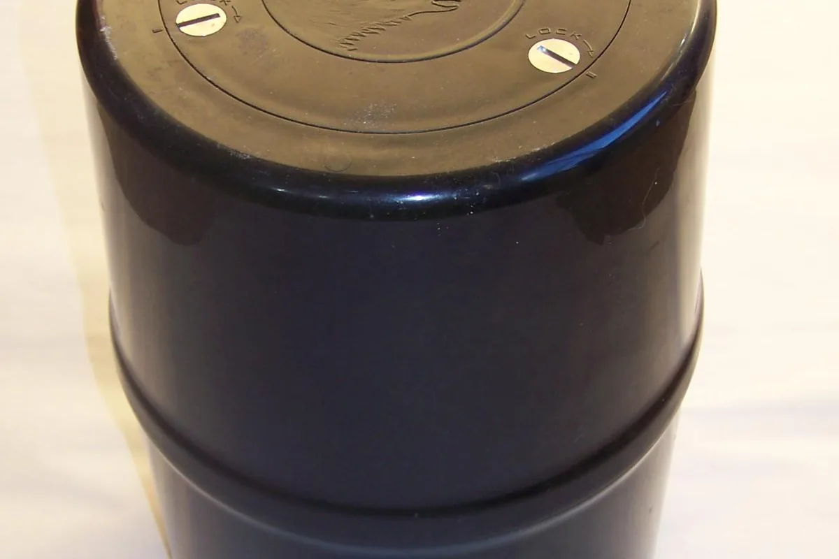 Rigid bear-resistant food canister on durable ground - Food storage | KnowOutdoor