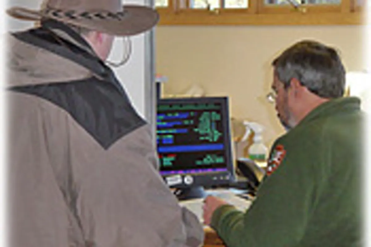 Visitor receiving help at a Grand Canyon backcountry permit desk