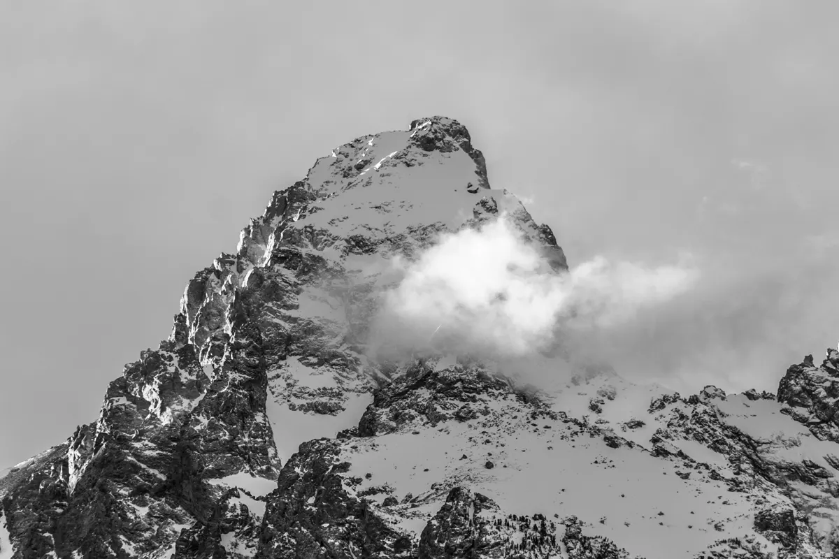 Snow clinging to the cragged summit of Grand Teton