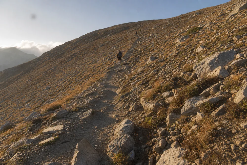 Long sustained trail climb rising continuously across an open hillside with no flat relief - choosing a day hike for your fitness | KnowOutdoor