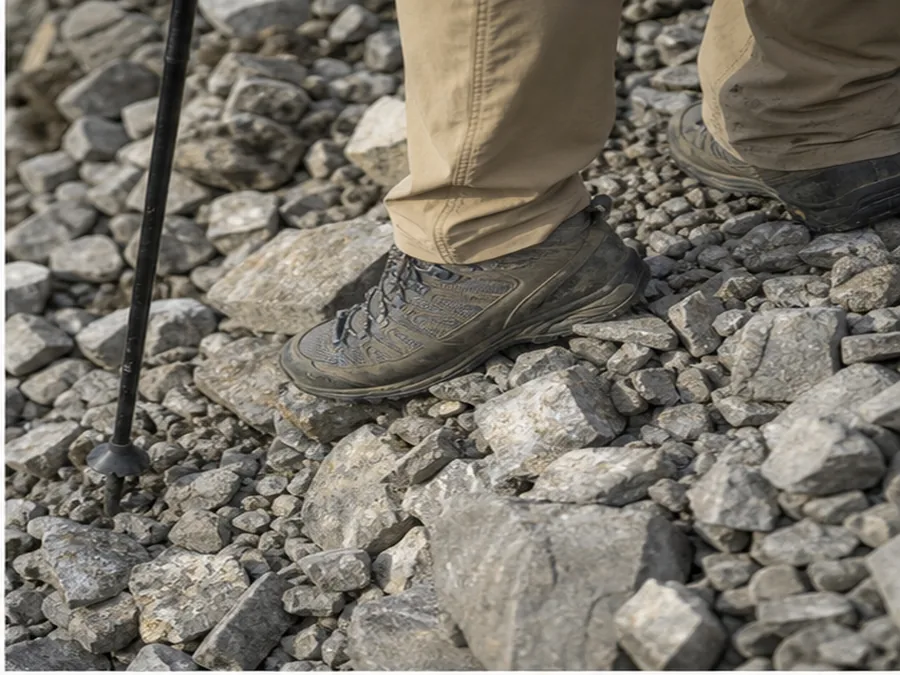 Boot testing small loose stones before weight transfer - how to hike on scree and loose rock | KnowOutdoor