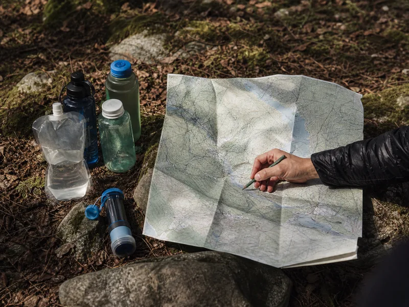 Map with water bottles and a marked refill planning point