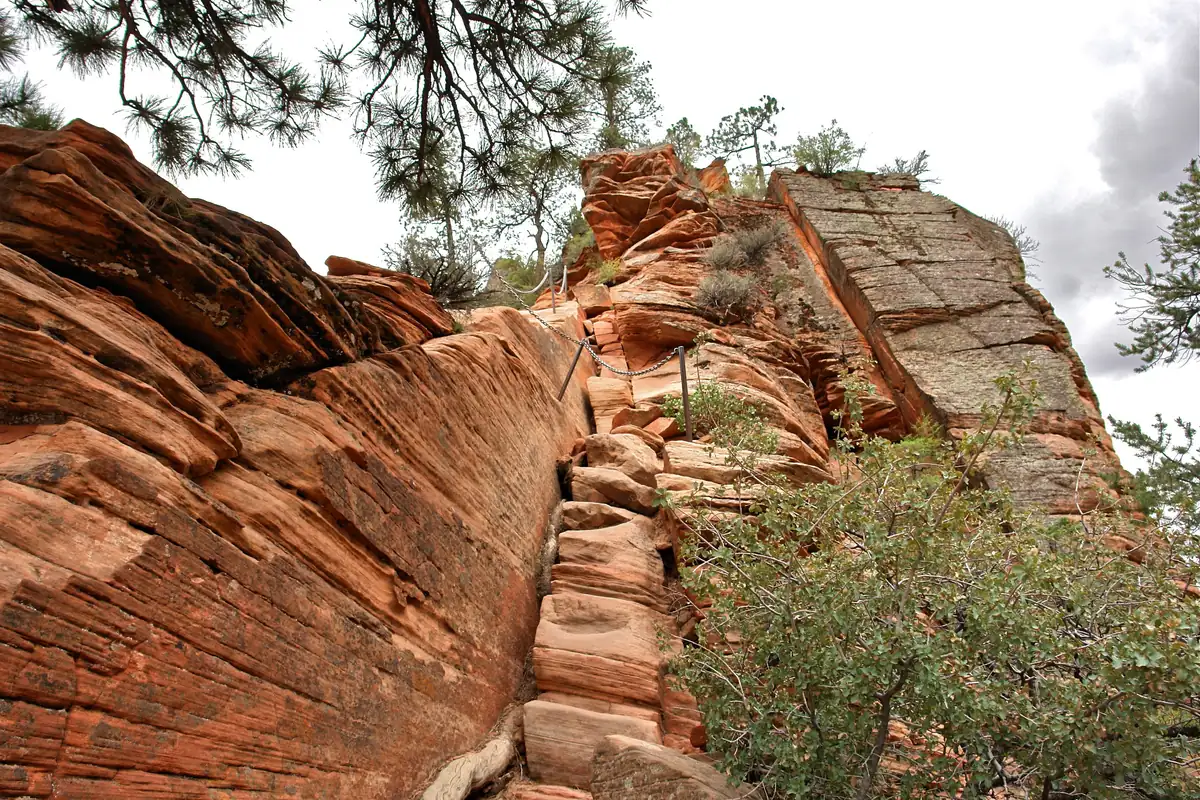 Steep carved sandstone steps and chains on the Angels Landing route