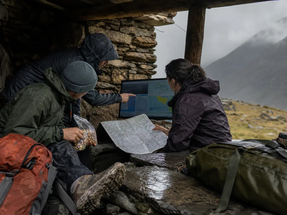 Trekking group compares weather, food, and route choices before deciding whether to rest - Trek schedule decision | KnowOutdoor