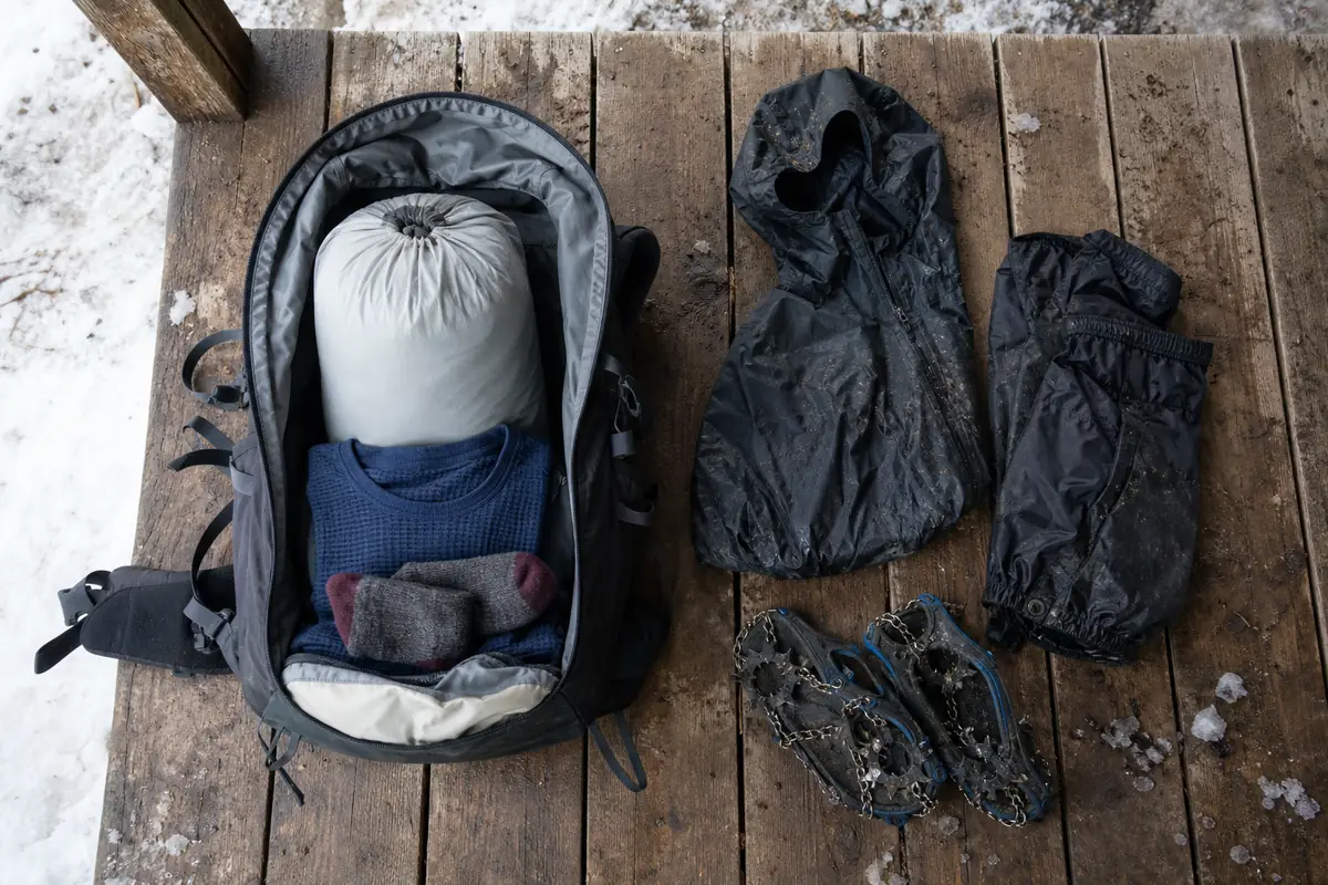 Winter trekking pack separated into sealed sleep insulation and damp travel gear - dry insulation system | KnowOutdoor